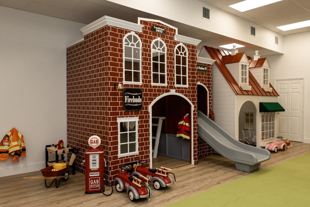 Firebuds play station with slide at Kids Hideout indoor playground Fort Lauderdale