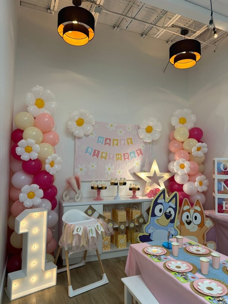 Bluey and Daisies birthday party decorations with character cutouts and daisy centerpieces at Kids Hideout