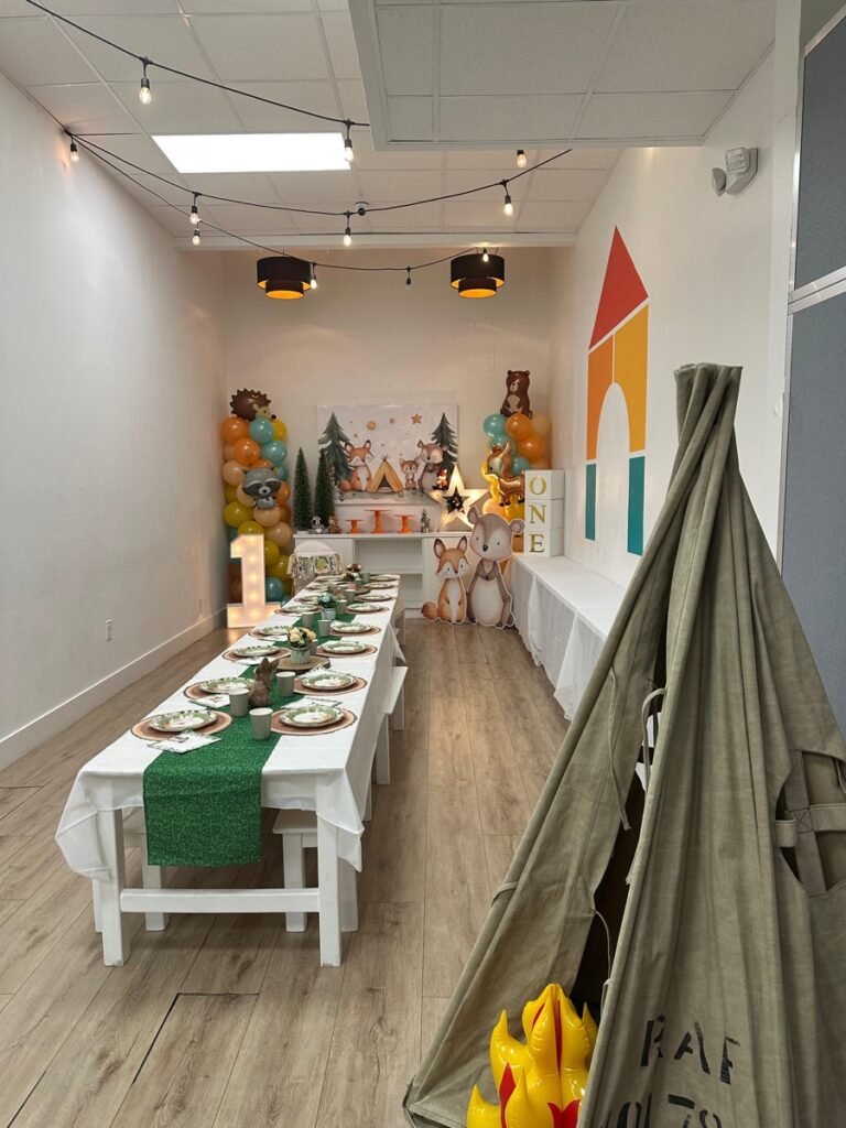 ONE Happy Camper woodland first birthday party theme with camping and forest decorations at Kids Hideout Fort Lauderdale