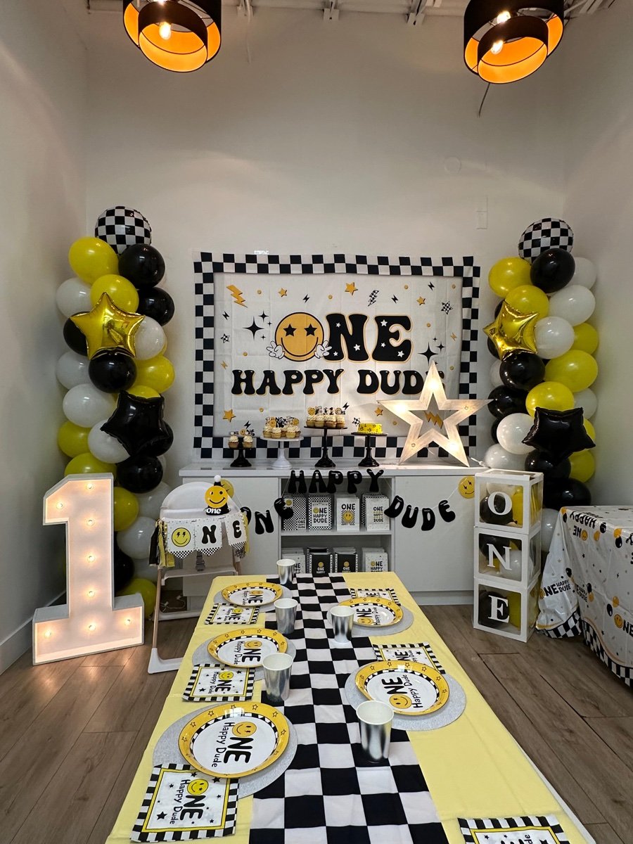 ONE Happy Dude first birthday party theme with retro smiley face decorations at Kids Hideout