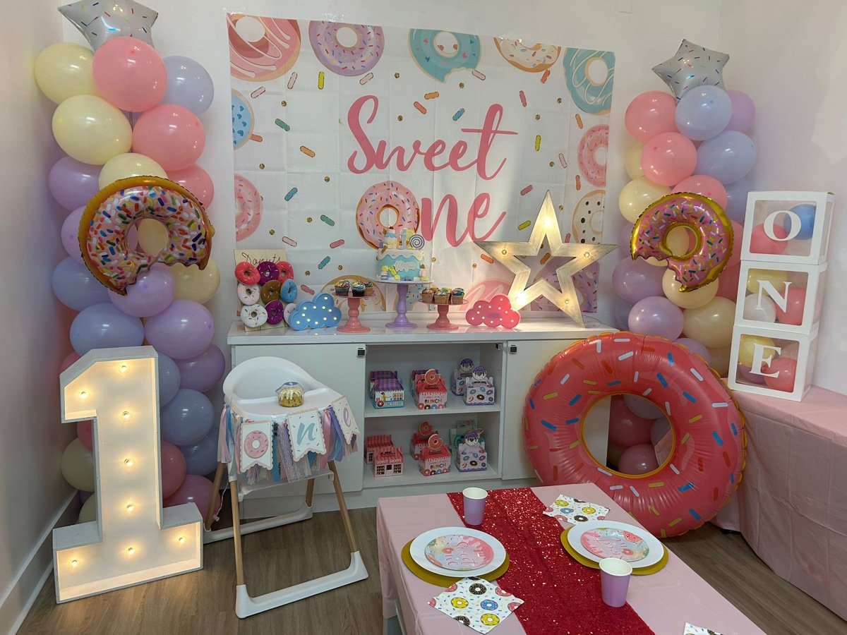Sweet ONE first birthday party theme with candy and dessert decorations, pastel colors at Kids Hideout Fort Lauderdale