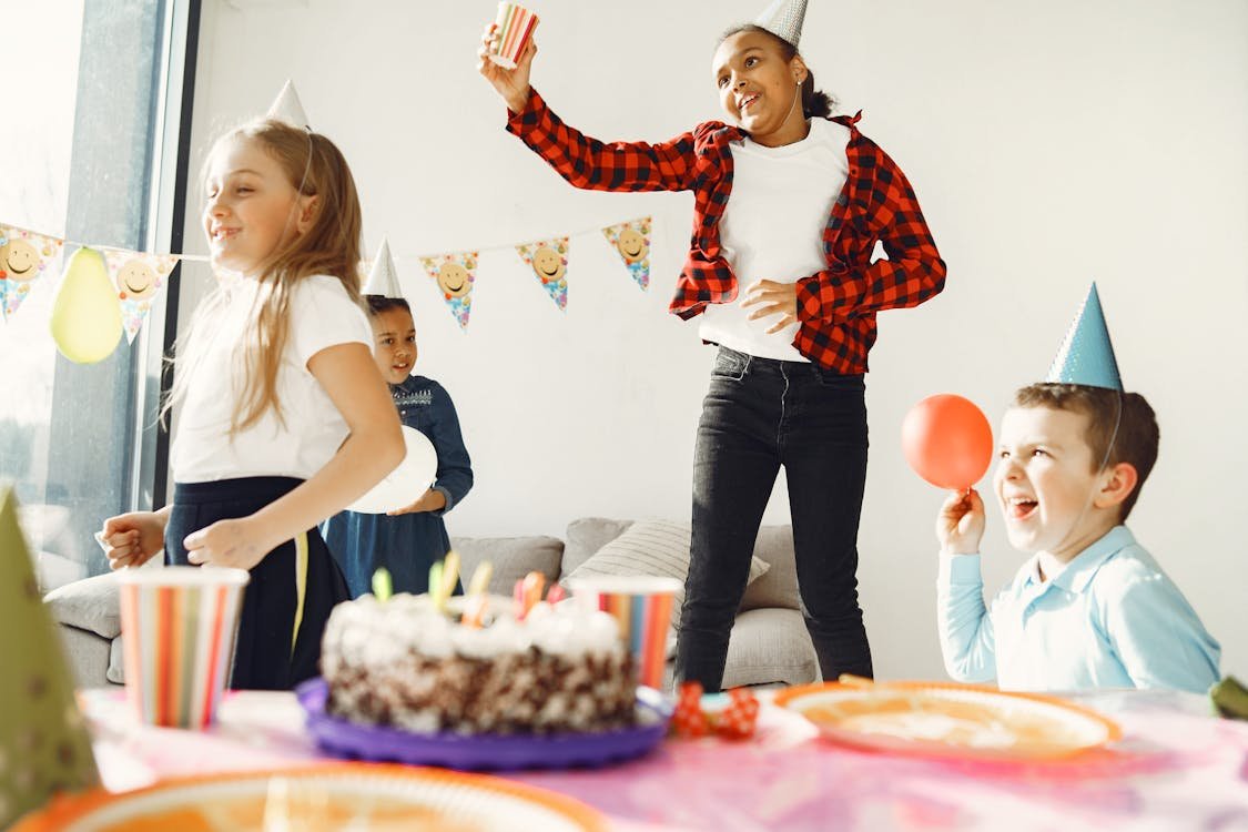 Group of kids friends celebrating at a birthday party