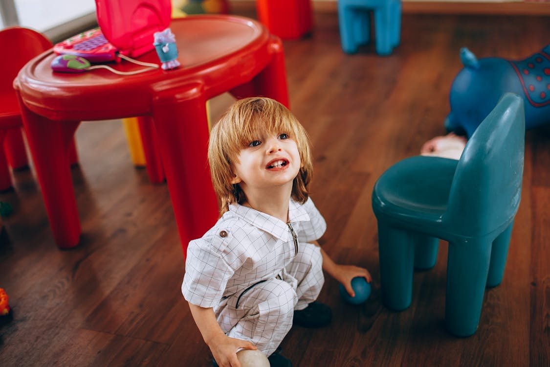 Cheerful child playing in a colorful indoor playroom in Fort Lauderdale