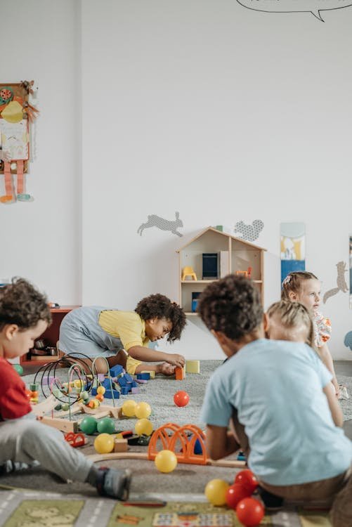 Kids engaged in fun indoor activities at a play center