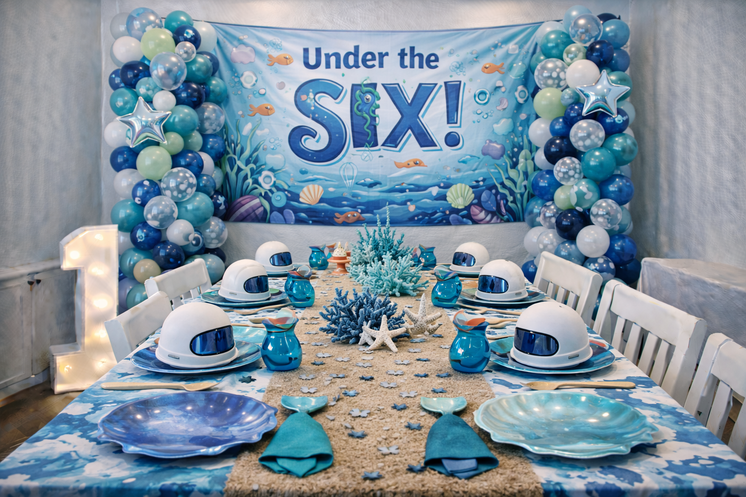 Under the sea birthday party banner with ocean decorations saying Under the SIX